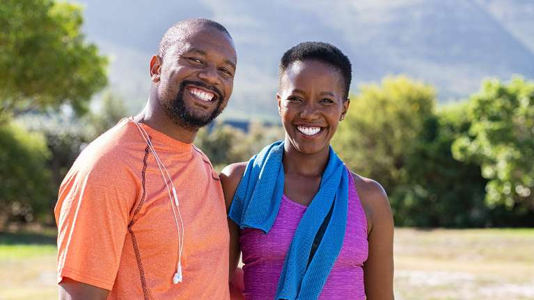 Couple smiling outdoors